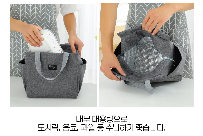 a woman is holding a gray bag and putting something in it