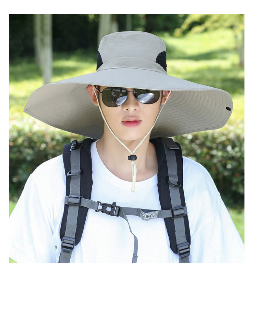 a young man wearing a hat and sunglasses